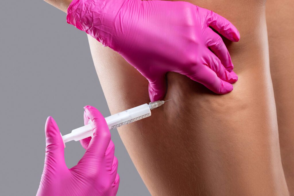 Provider giving an injectable vitamin shot.