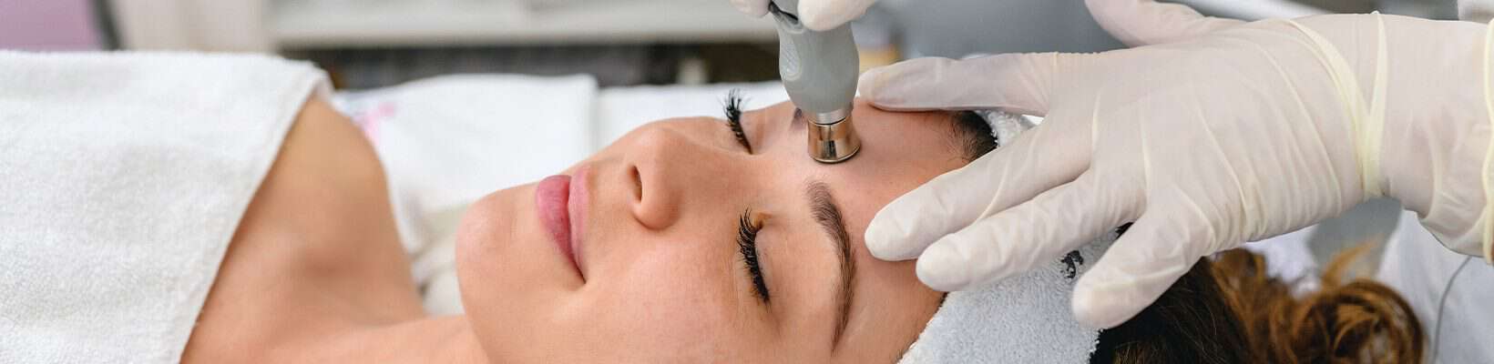 woman having a laser used on her skin